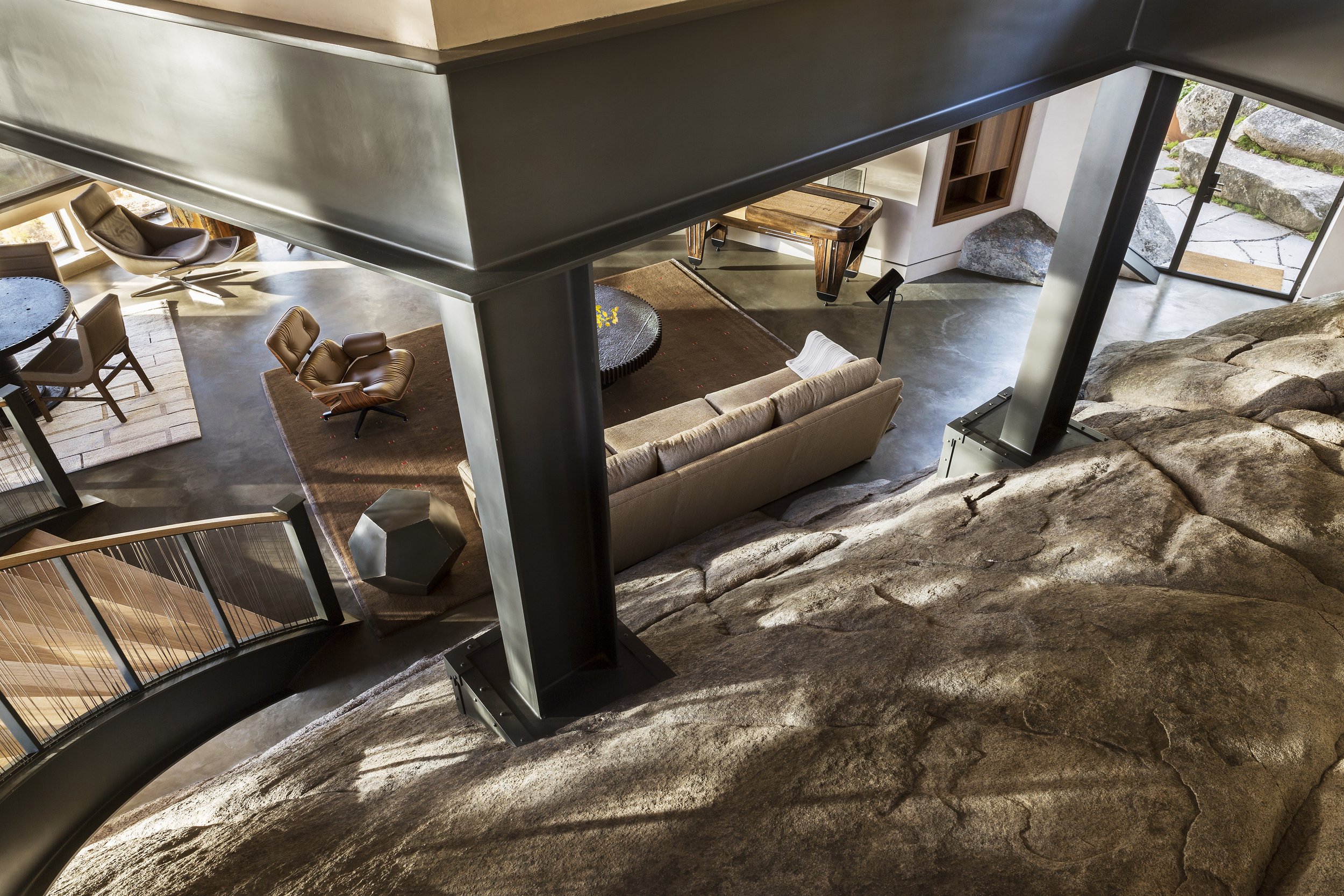 Living Area with Exposed Rock Formations in Modern McCall, Idaho Home
