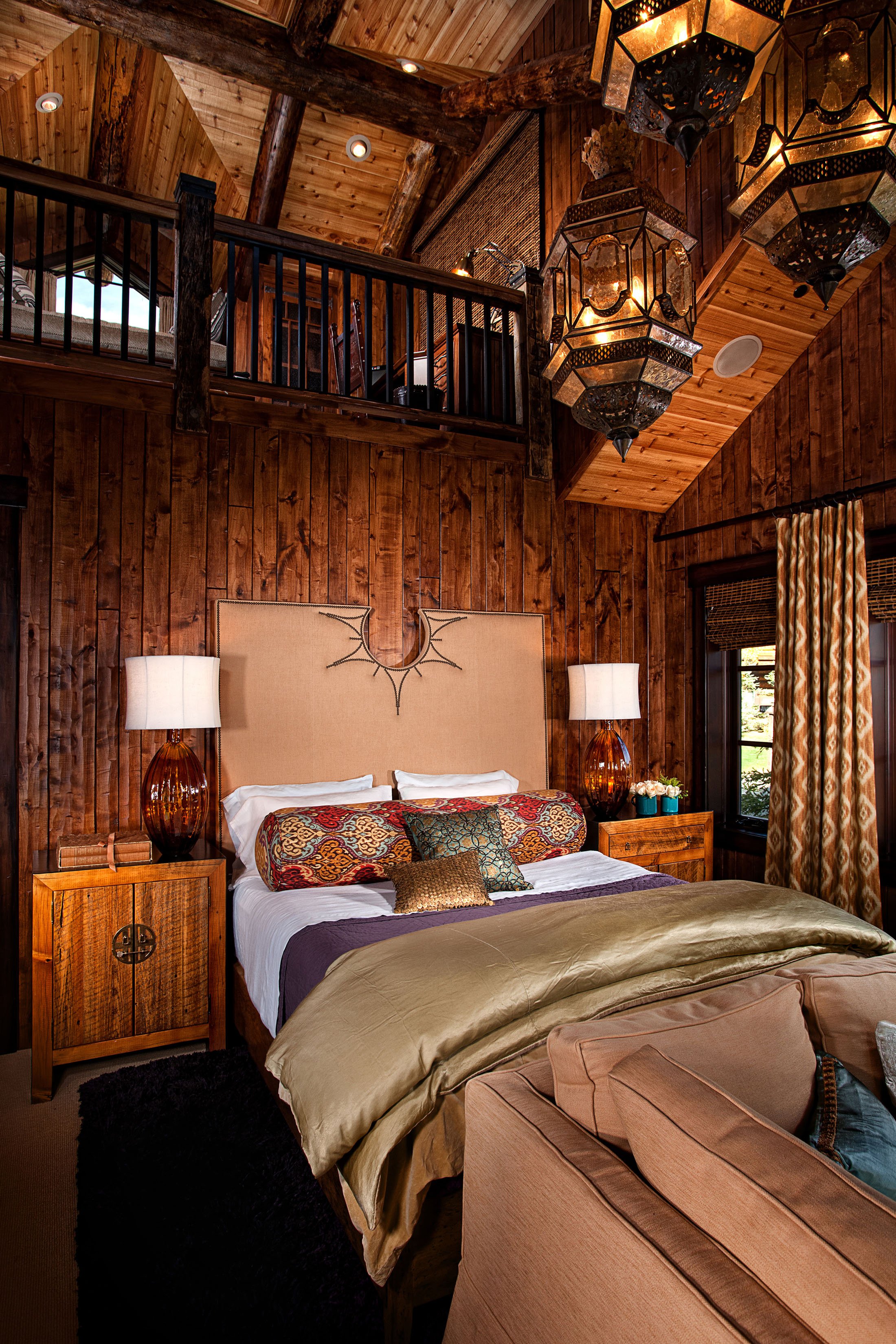 Rustic Master Bedroom with Wooden Walls and Luxury Lighting in Mammoth Lakes, CA