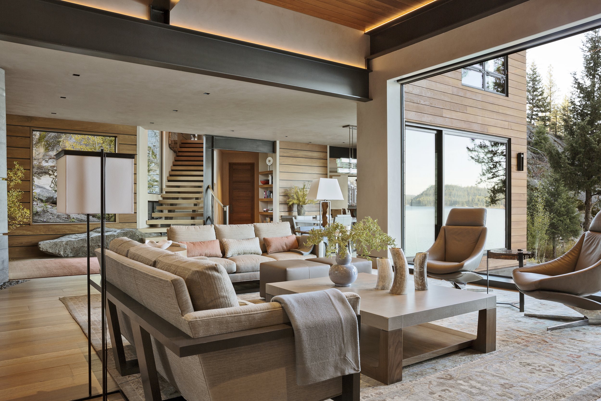 Modern Living Room with Stone Fireplace and Scenic Views in McCall, Idaho