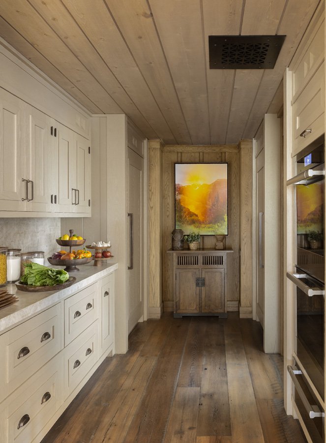 Rustic Hallway with Artistic Touches by Brown Design Group in Mammoth Lakes, CA
