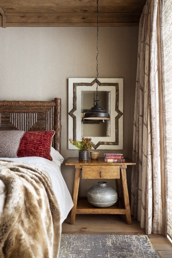 Modern Rustic Bedroom with Antique Mirror and Fur Bedding in Mammoth Lakes, CA