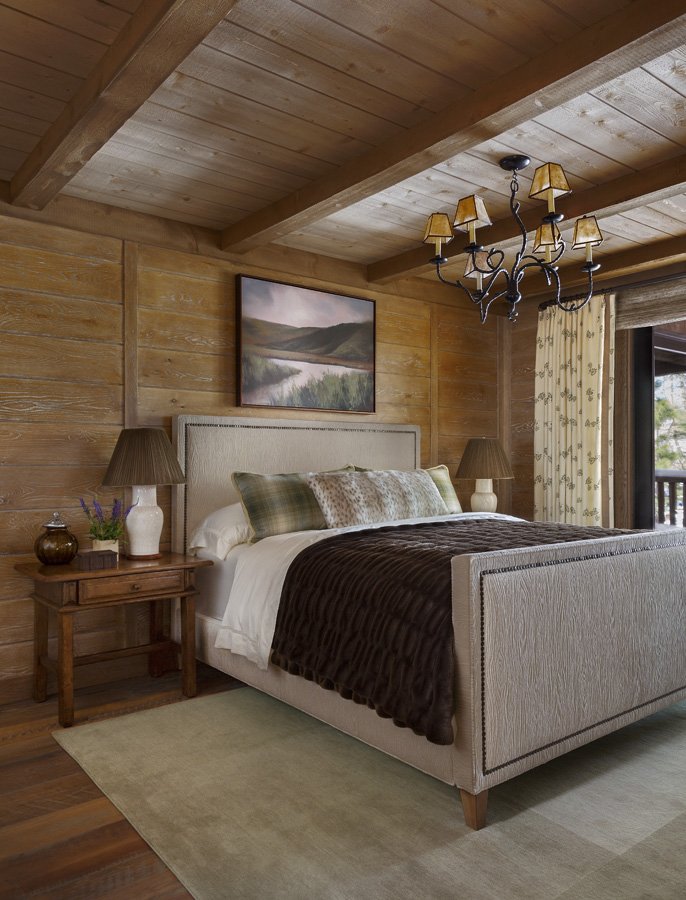 Modern Rustic Bedroom with Large Windows and Fur Bedding in Mammoth Lakes, CA