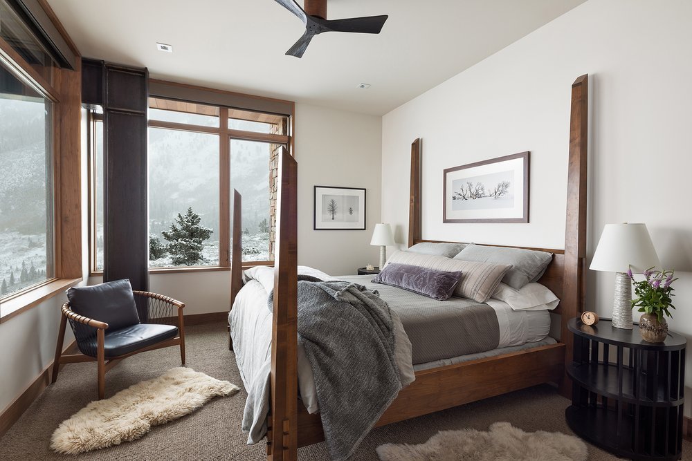 Modern Bedroom with Large Windows and Fur Bedding in Mammoth Lakes, CA