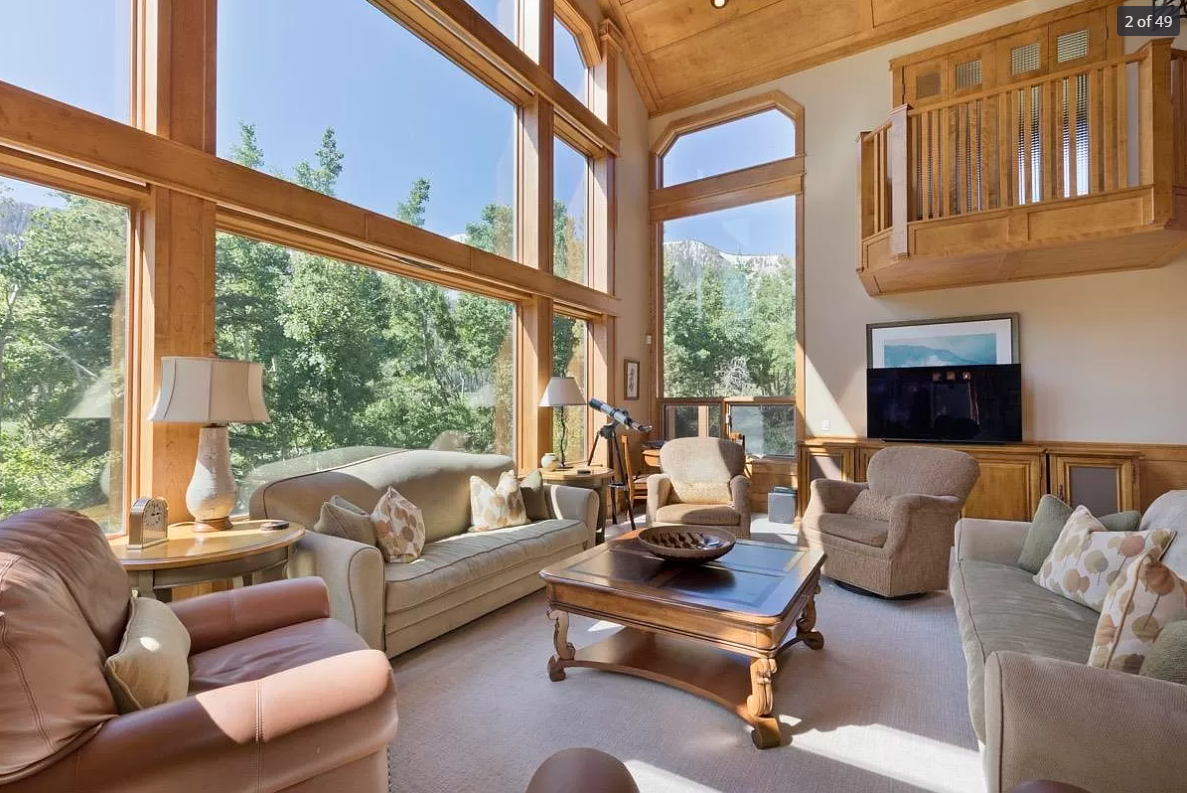 before-remodel-rustic-living-room-large-windows-mammoth-lakes.png